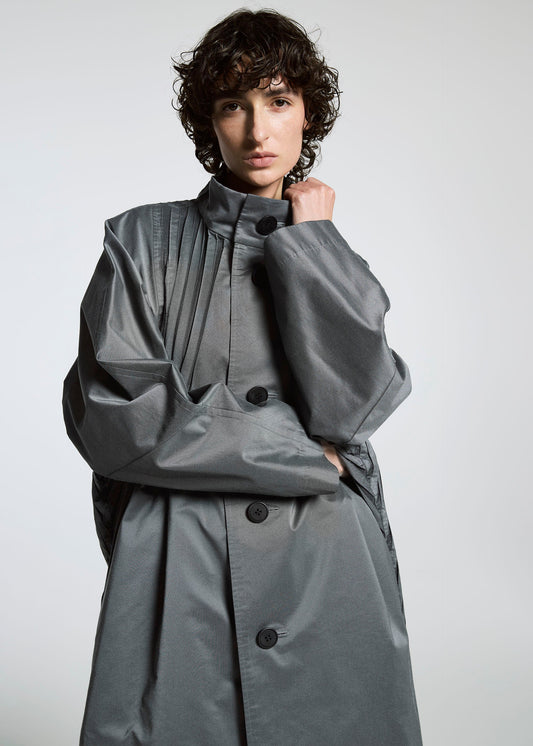 A model wears the A-Poc Able Issey Miyake TYPE S 001 1 coat.