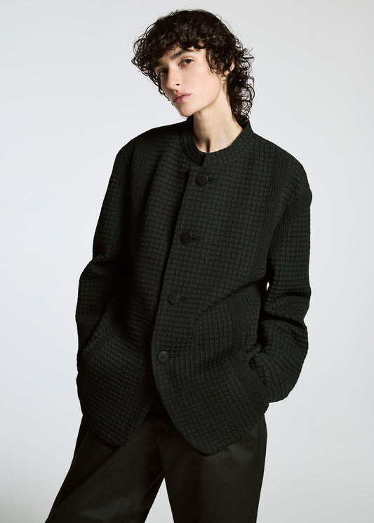 A model wears the APOCABLE TYPE O 014 prêt à porter.