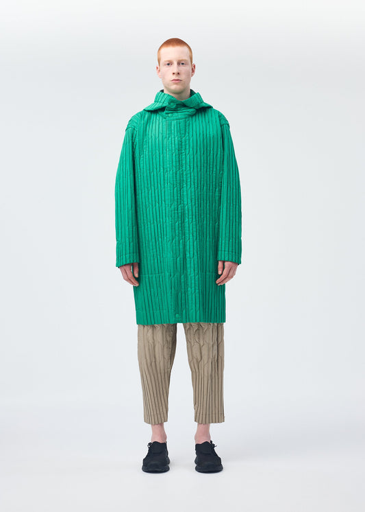 A model wears the Homme Plisse Issey Miyake PADDED PLEATS coat.