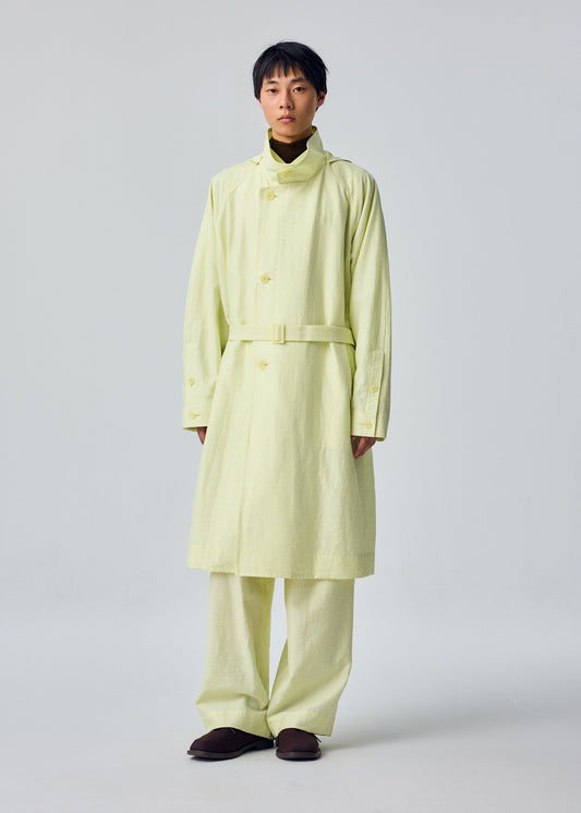 A model wears the HOMME PLISSÉ ISSEY MIYAKE OPACITY coat.