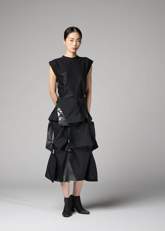 A model wears the 132 5. ISSEY MIYAKE No.1-2 skirt.