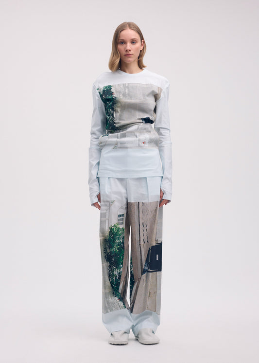 A model wears the Issey Miyake STREET VIEW shirt.