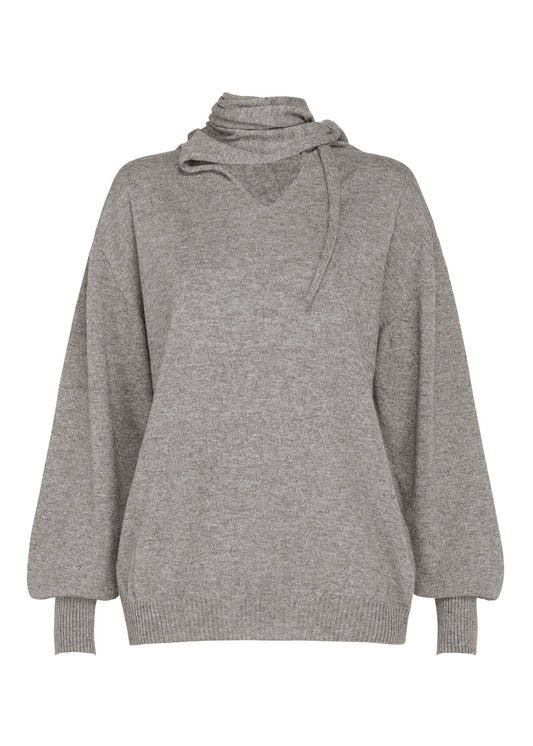 A product shot of the ISSEY MIYAKE SILK CASHMERE KNIT top in light gray.