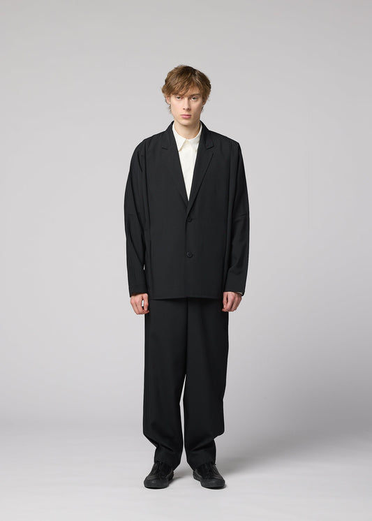A model wears the IM MEN FLAT BLACK jacket.