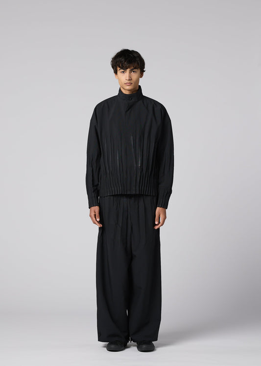 A model wears the IM MEN WAFT BLACK waft-black-trousers-black-1-fw26.