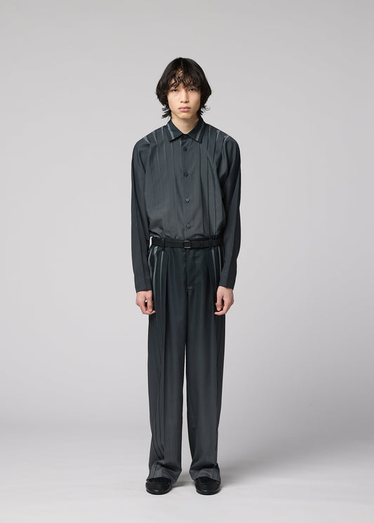 A model wears the IM MEN DAWN RAY trousers.