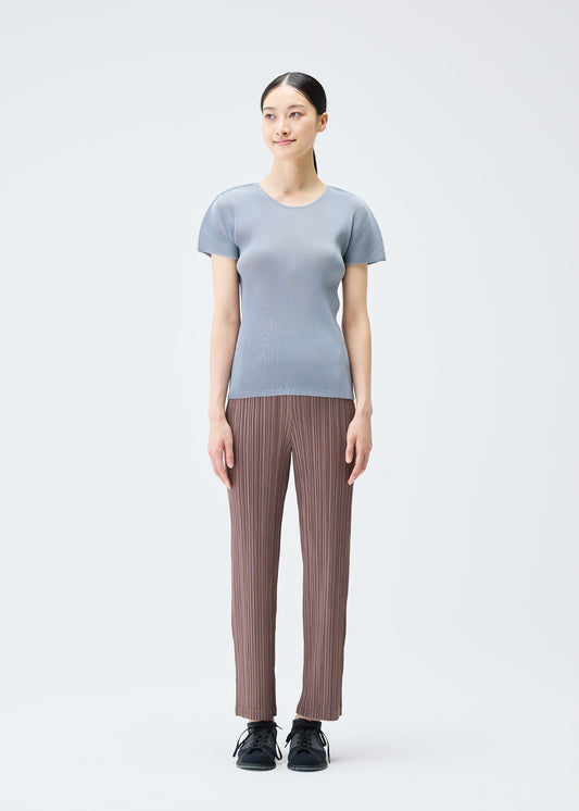 A model wears the Pleats Please Issey Miyake MIST SEPTEMBER top.