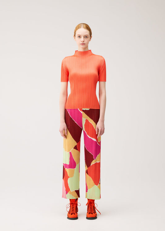 A model wears the PLEATS PLEASE ISSEY MIYAKE SURPRISE! trousers.