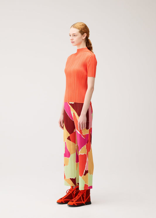 A model wears the PLEATS PLEASE ISSEY MIYAKE SURPRISE! trousers.