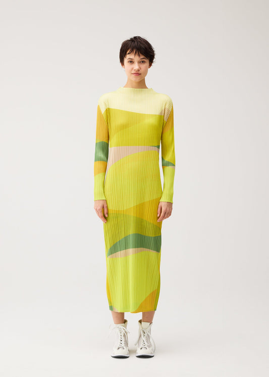 A model wears the PLEATS PLEASE ISSEY MIYAKE ORBIT orbit-dress-yellow.