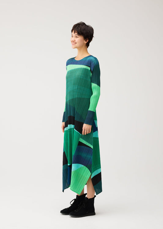 A model wears the PLEATS PLEASE ISSEY MIYAKE ORBIT dress.