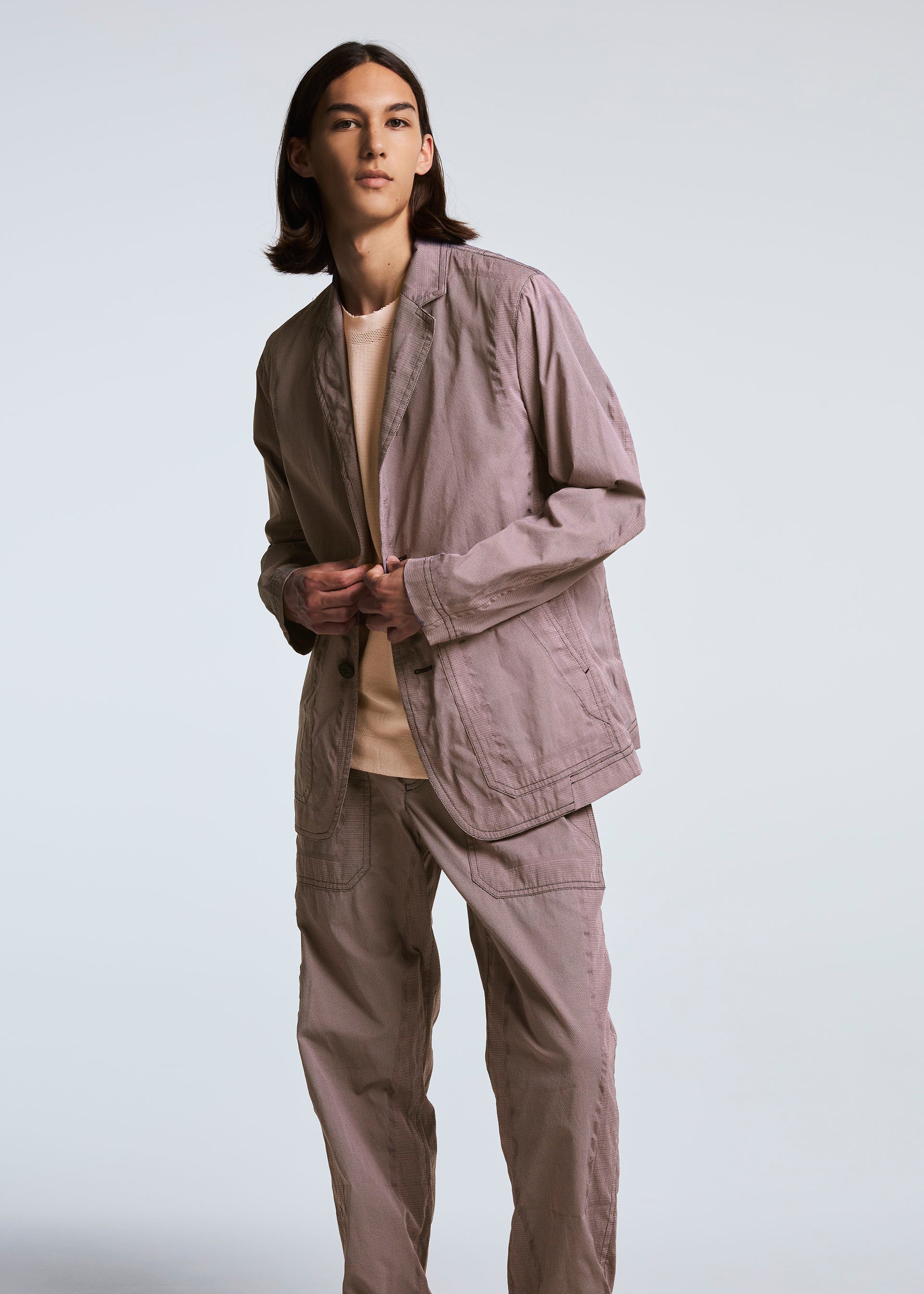 A model wears the A-POC ABLE ISSEY MIYAKE TYPE U 001 jacket.