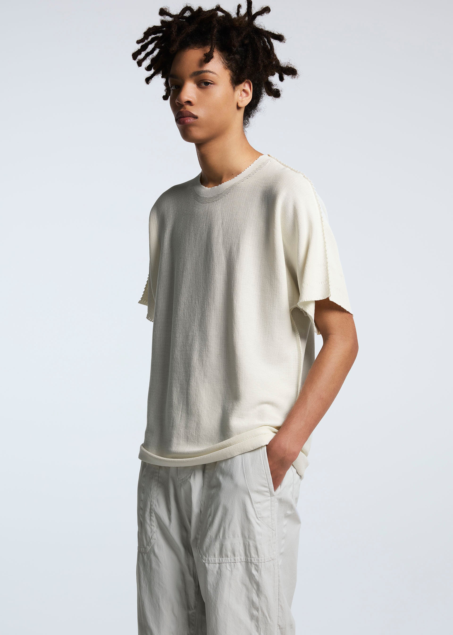 A model wears the A-POC ABLE ISSEY MIYAKE TYPE U 001 trousers.