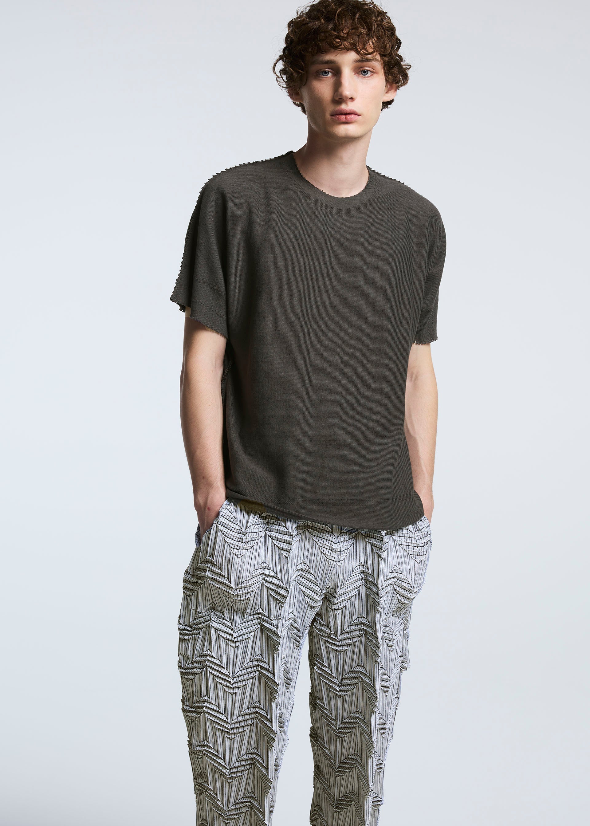 A model wears the A-POC ABLE ISSEY MIYAKE TYPE O 019 trousers.