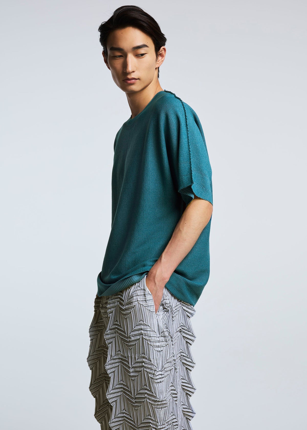 A model wears the A-POC ABLE ISSEY MIYAKE TYPE O 019 trousers.