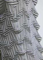 A model wears the A-POC ABLE ISSEY MIYAKE TYPE O 019 trousers.