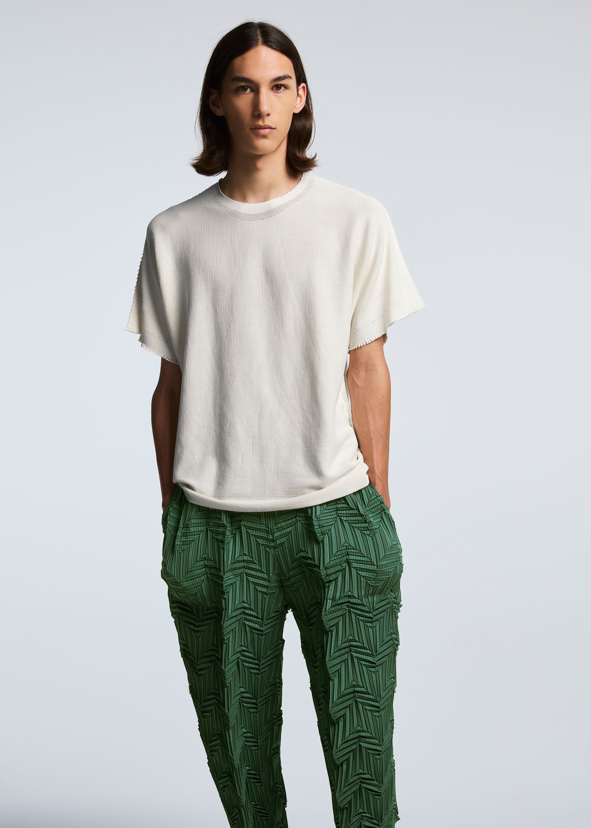 A model wears the A-POC ABLE ISSEY MIYAKE TYPE O 019 trousers.