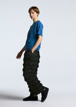 A model wears the A-POC ABLE ISSEY MIYAKE TYPE O 019 trousers.