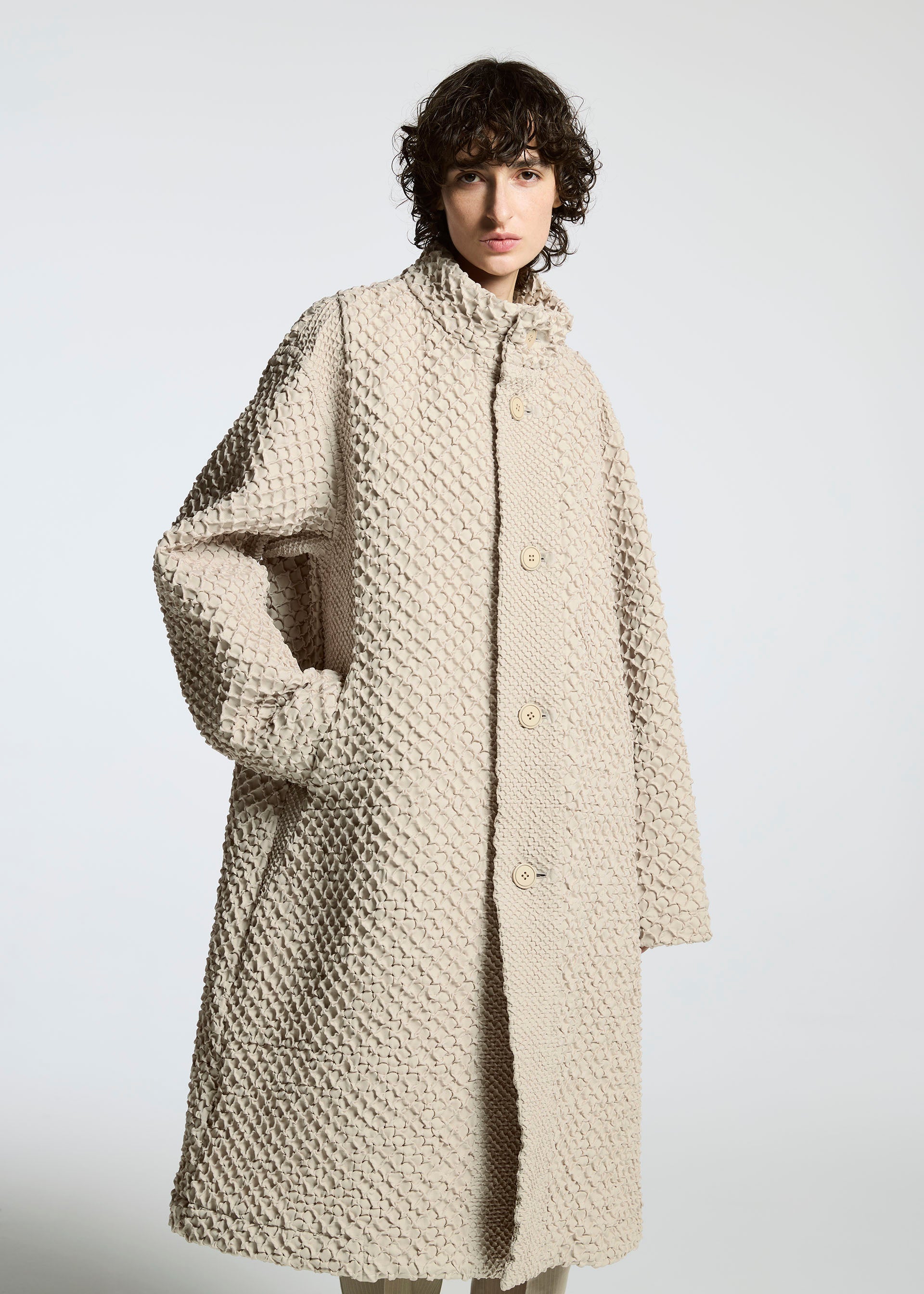 A model wears the A-Poc Able Issey Miyake TYPE O 011 coat.