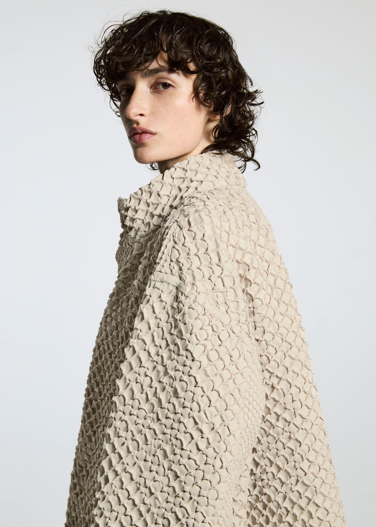 A model wears the A-Poc Able Issey Miyake TYPE O 011 coat.