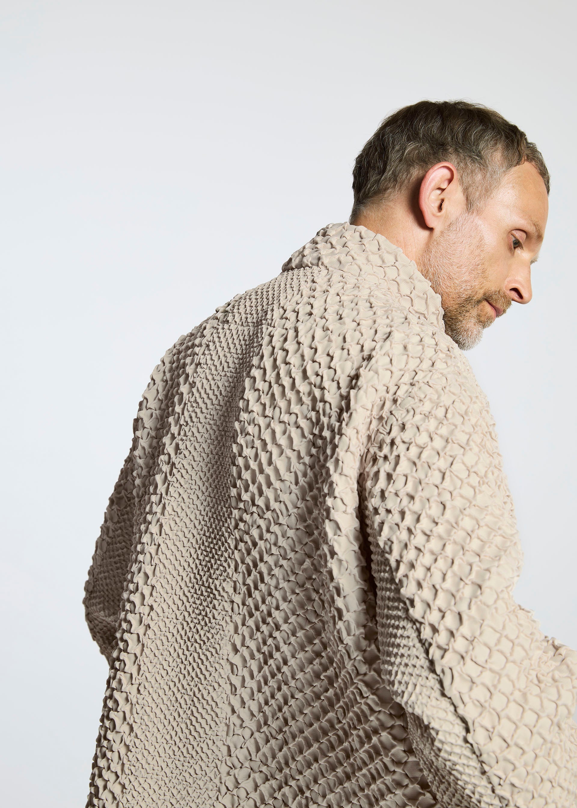 A model wears the A-Poc Able Issey Miyake TYPE O 011 coat.