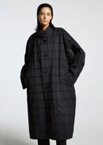 A model wears the APOCABLE TYPE O 002 prêt à porter.