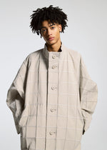 A model wears the APOCABLE TYPE O 002 prêt à porter.