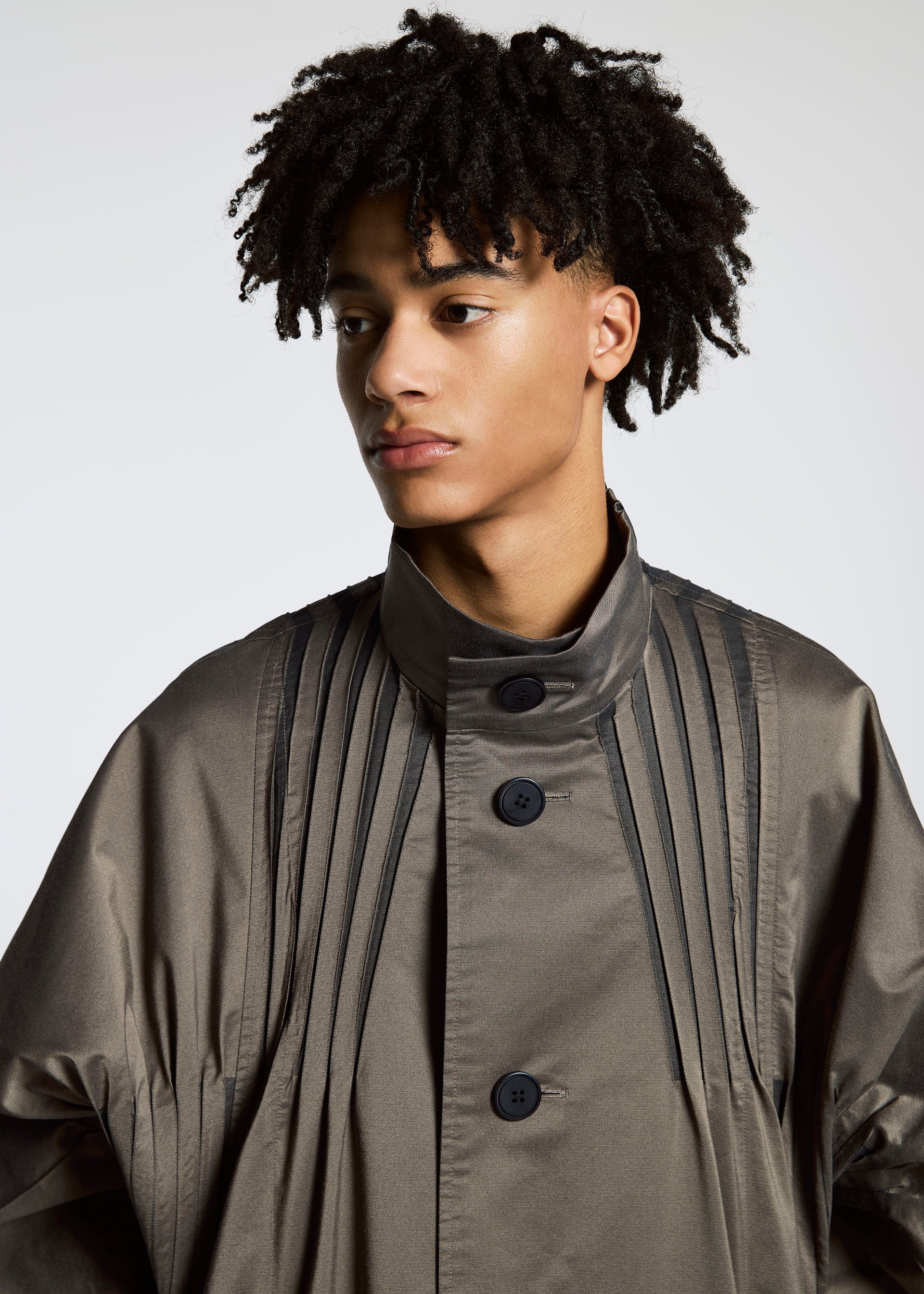A model wears the A-Poc Able Issey Miyake TYPE S 001 1 coat.