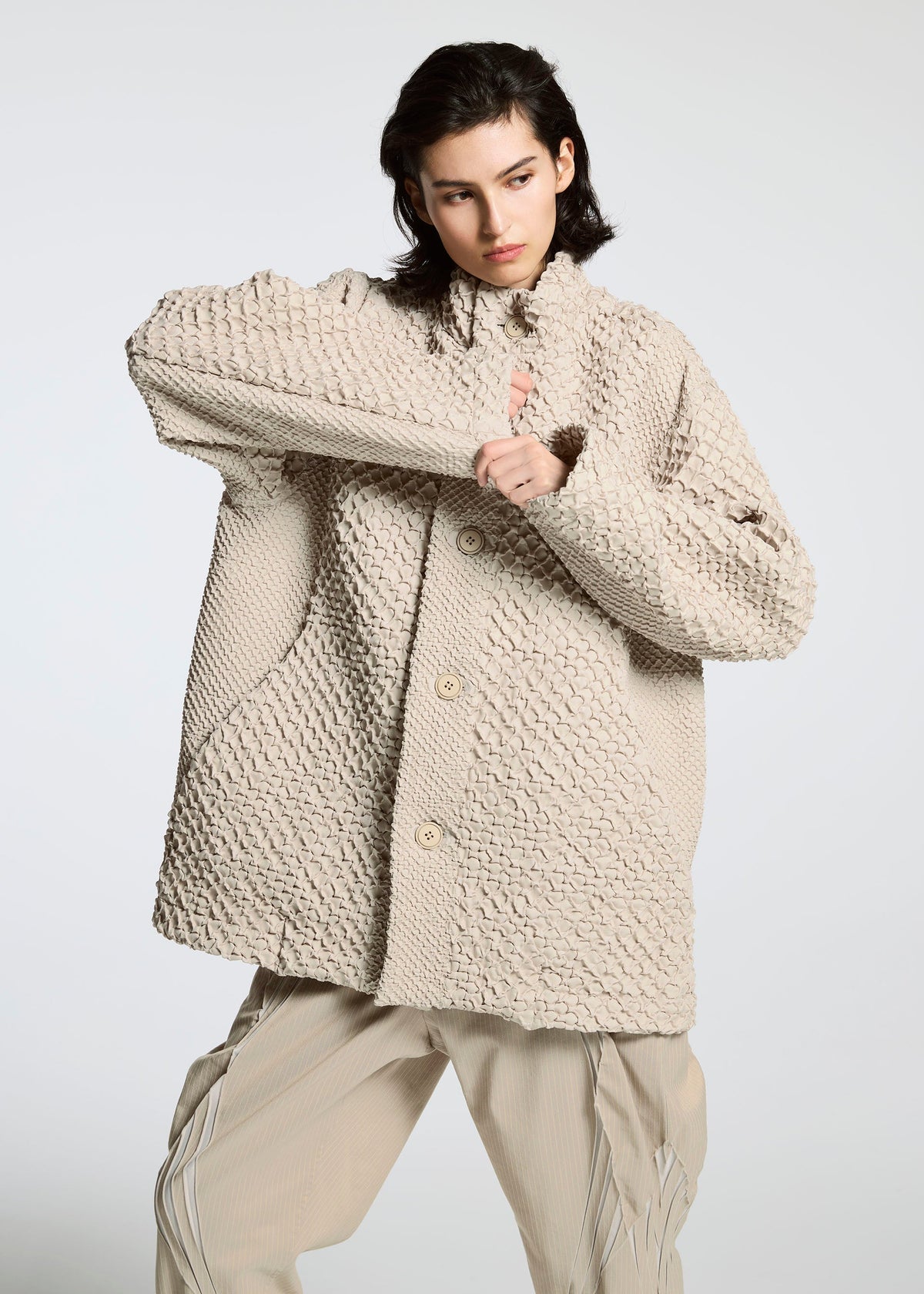 A model wears the A-Poc Able Issey Miyake TYPE O 011 blouson.