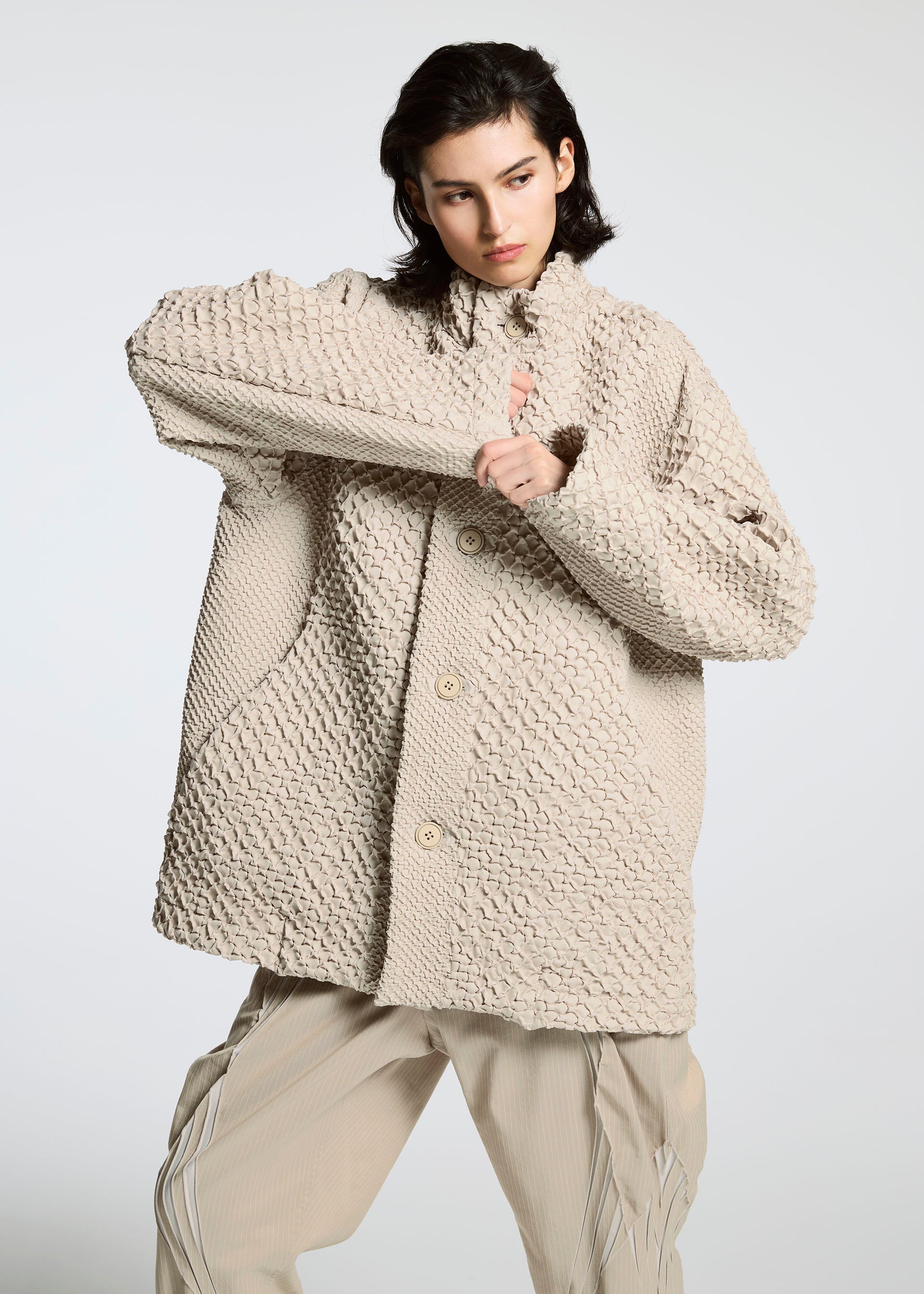 A model wears the A-Poc Able Issey Miyake TYPE O 011 blouson.