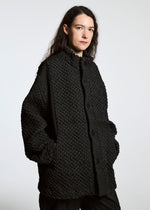 A model wears the A-Poc Able Issey Miyake TYPE O 011 blouson.