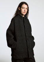 A model wears the A-Poc Able Issey Miyake TYPE O 011 blouson.