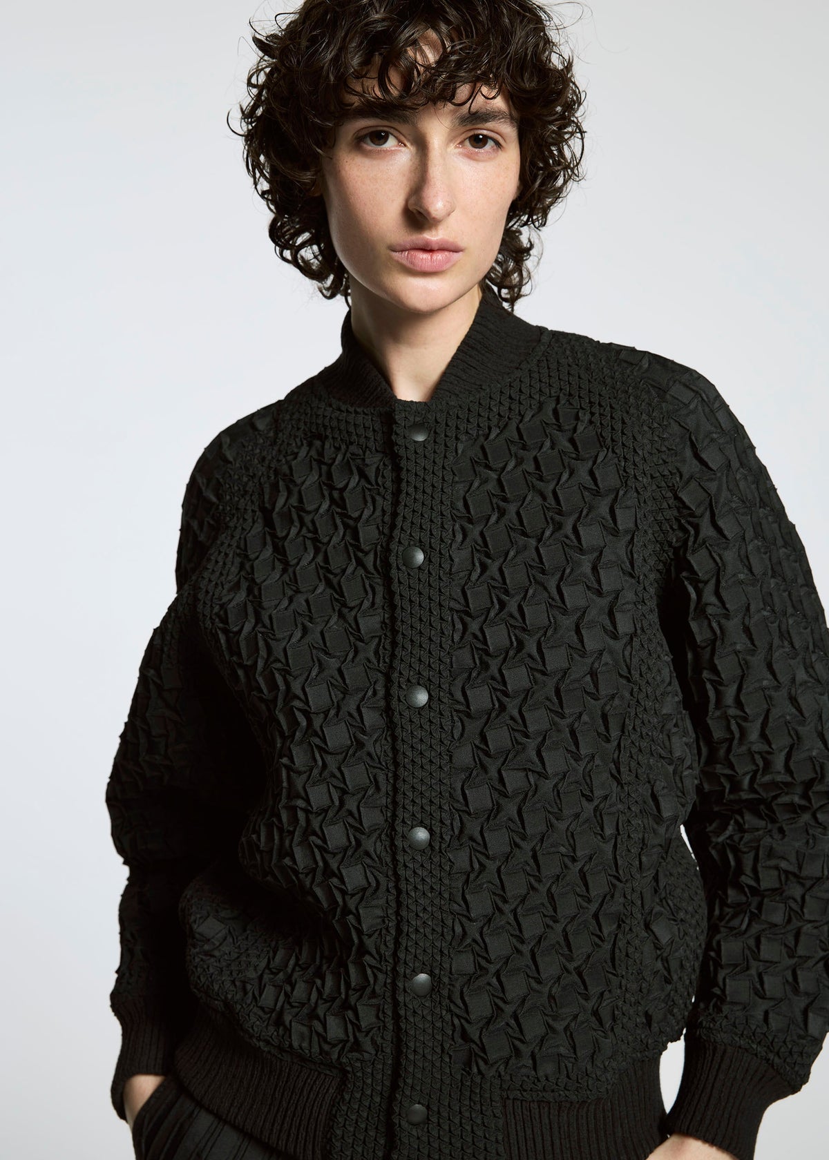 A model wears the A-POC ABLE ISSEY MIYAKE TYPE O 001 jacket.
