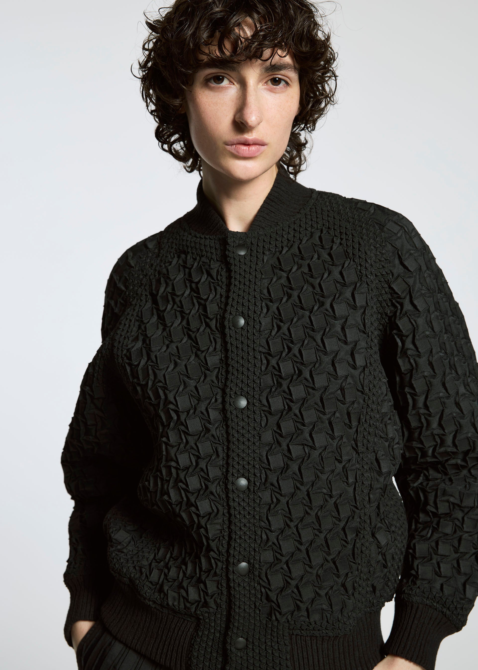 A model wears the A-POC ABLE ISSEY MIYAKE TYPE O 001 jacket.