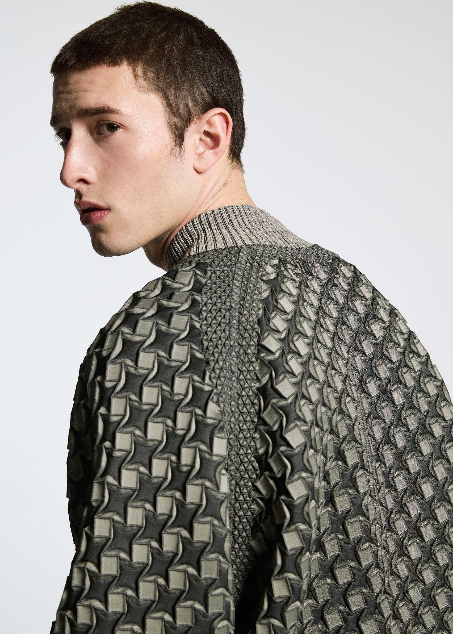 A model wears the A-POC ABLE ISSEY MIYAKE TYPE O 001 jacket.