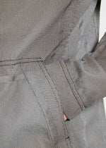 A model wears the APOCABLE TYPE U 001 prêt à porter.