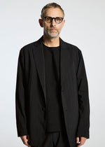 A model wears the A-Poc Able Issey Miyake TYPE ? 007 jacket.