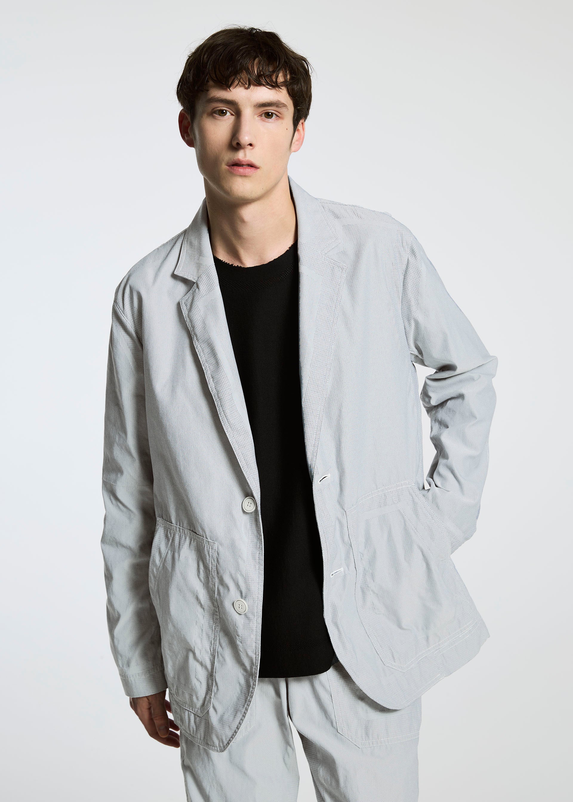 A model wears the APOCABLE TYPE U 001 prêt à porter.