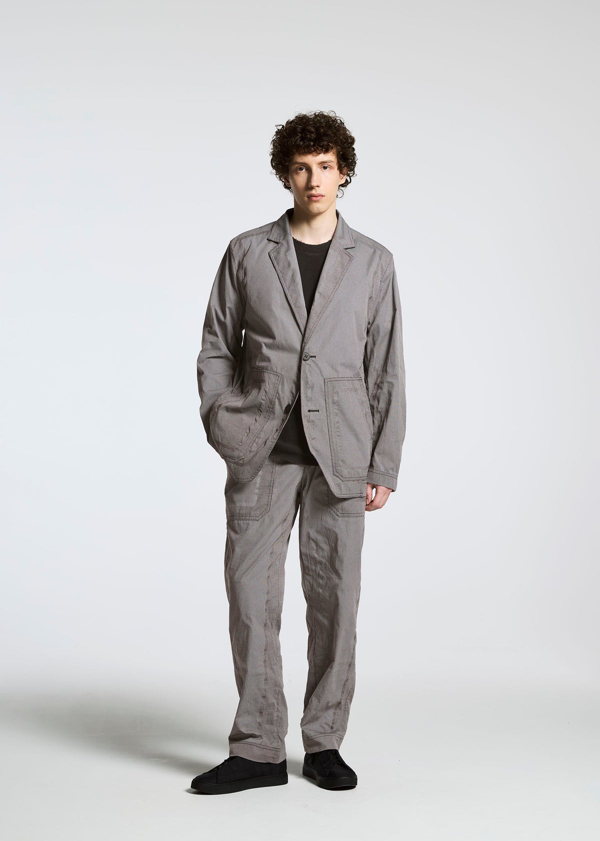 A model wears the APOCABLE TYPE U 001 prêt à porter.