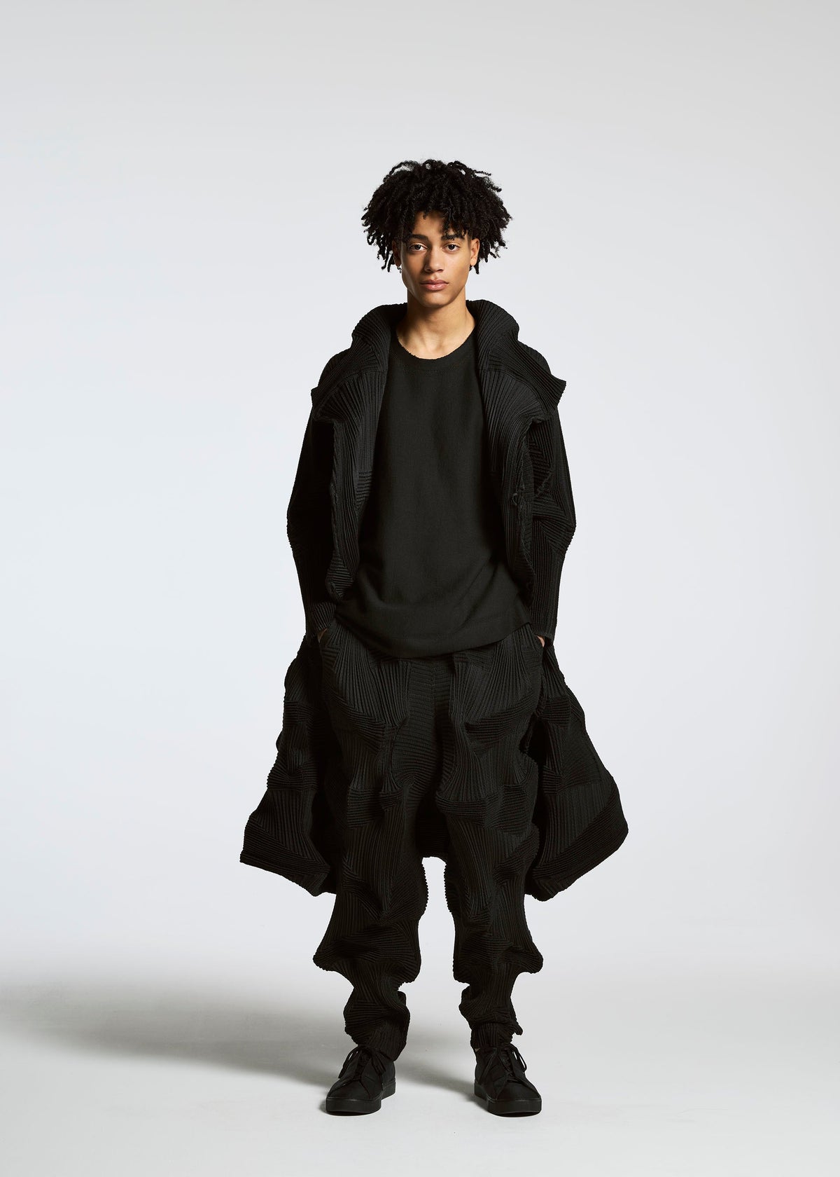 A model wears the A-Poc Able Issey Miyake TYPE O 020 trousers.