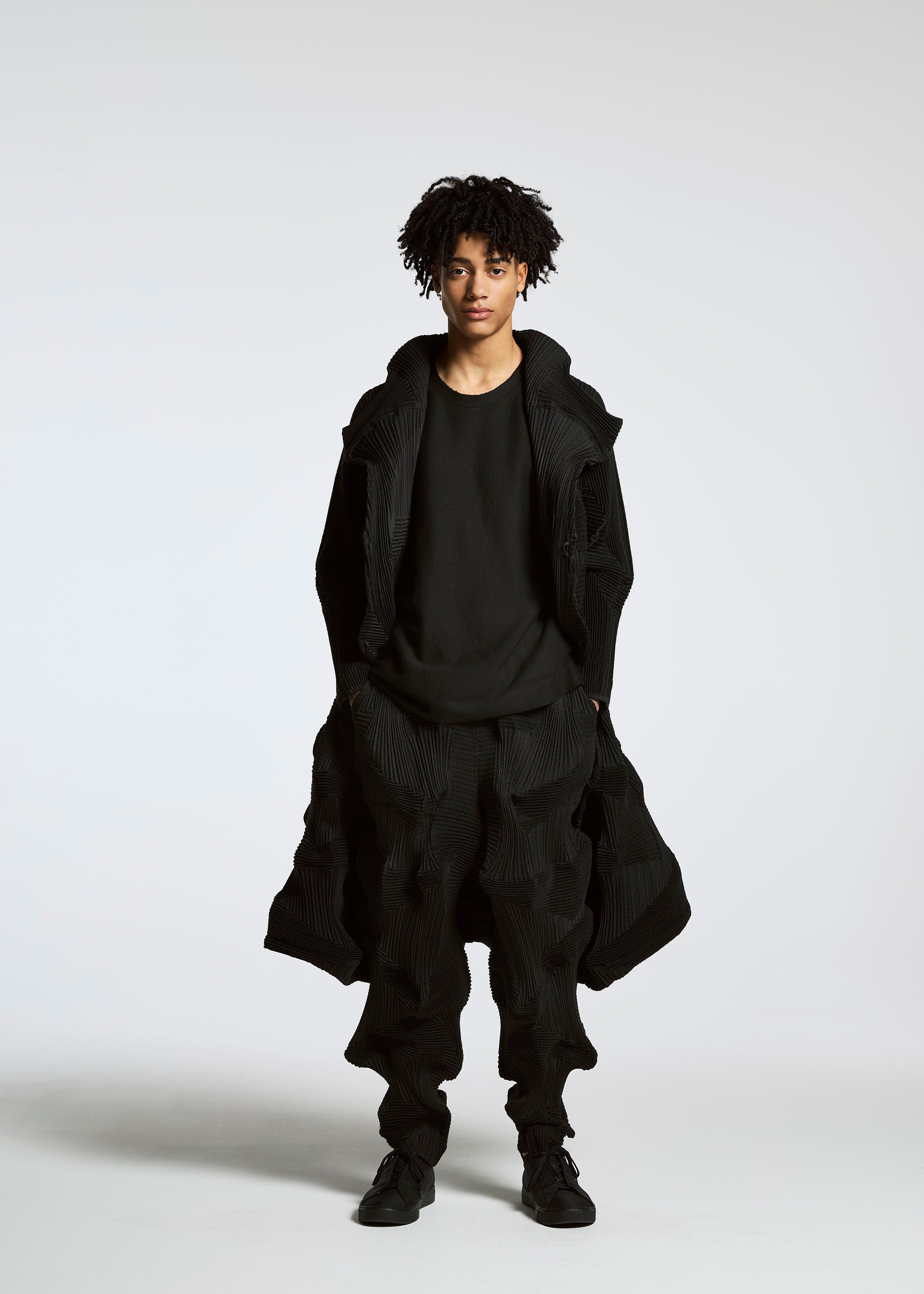 A model wears the A-Poc Able Issey Miyake TYPE O 020 trousers.