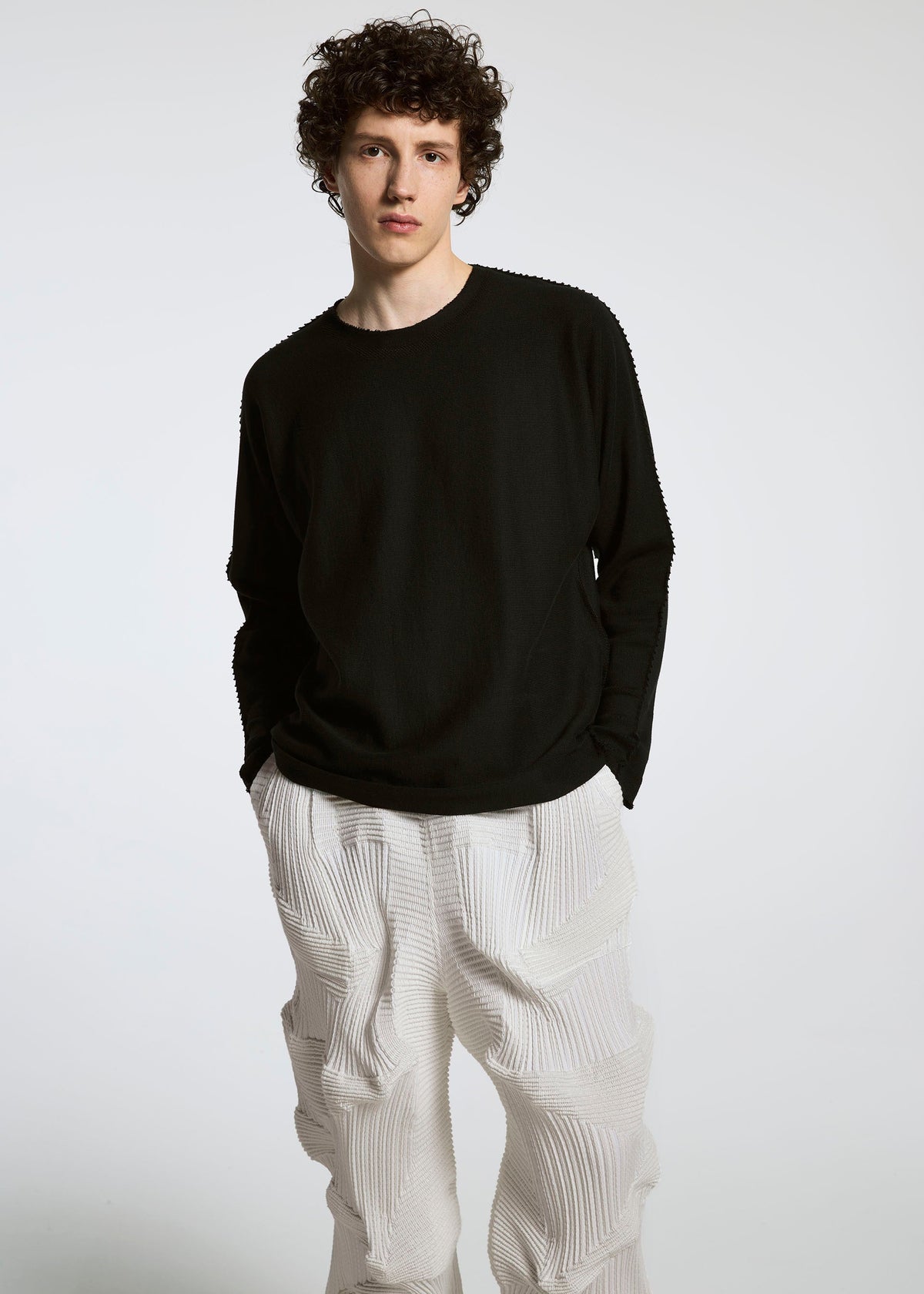A model wears the A-Poc Able Issey Miyake TYPE O 020 trousers.