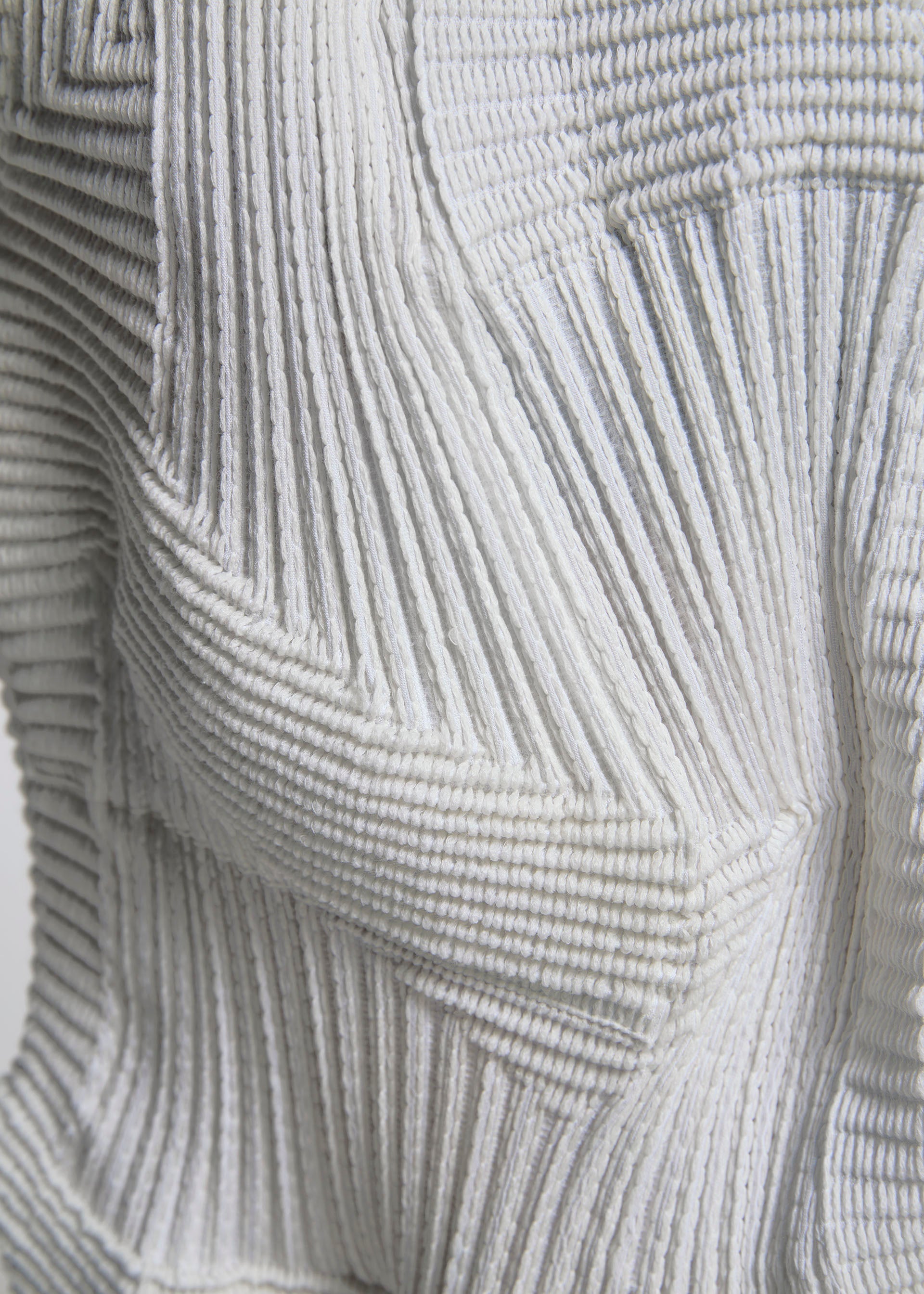 A model wears the A-Poc Able Issey Miyake TYPE O 020 trousers.