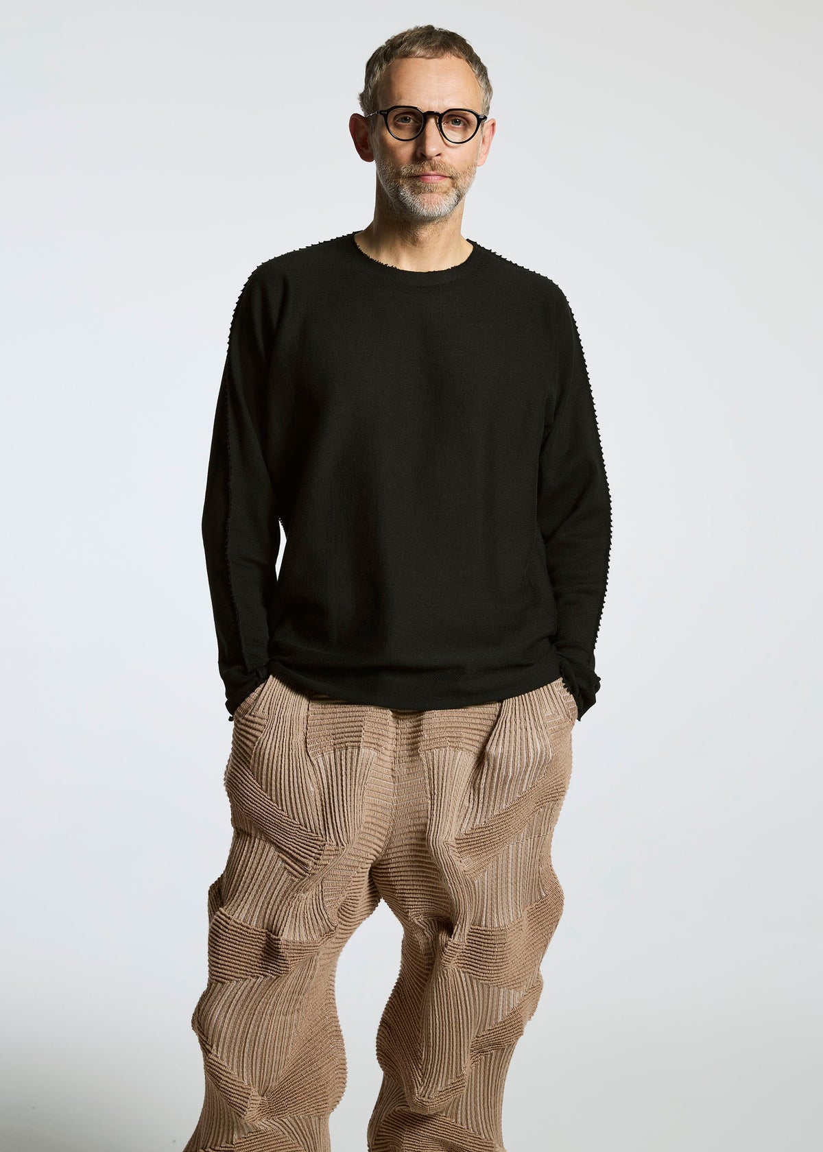 A model wears the A-Poc Able Issey Miyake TYPE O 020 trousers.