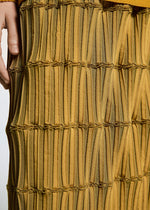 A model wears the A-Poc Able Issey Miyake TYPE O 015 trousers.