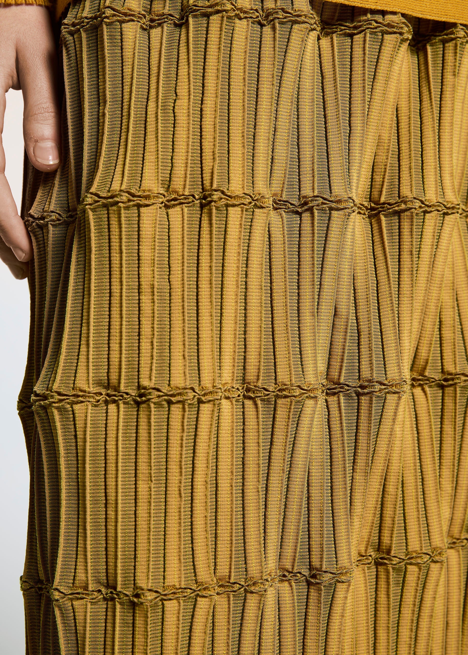 A model wears the A-Poc Able Issey Miyake TYPE O 015 trousers.