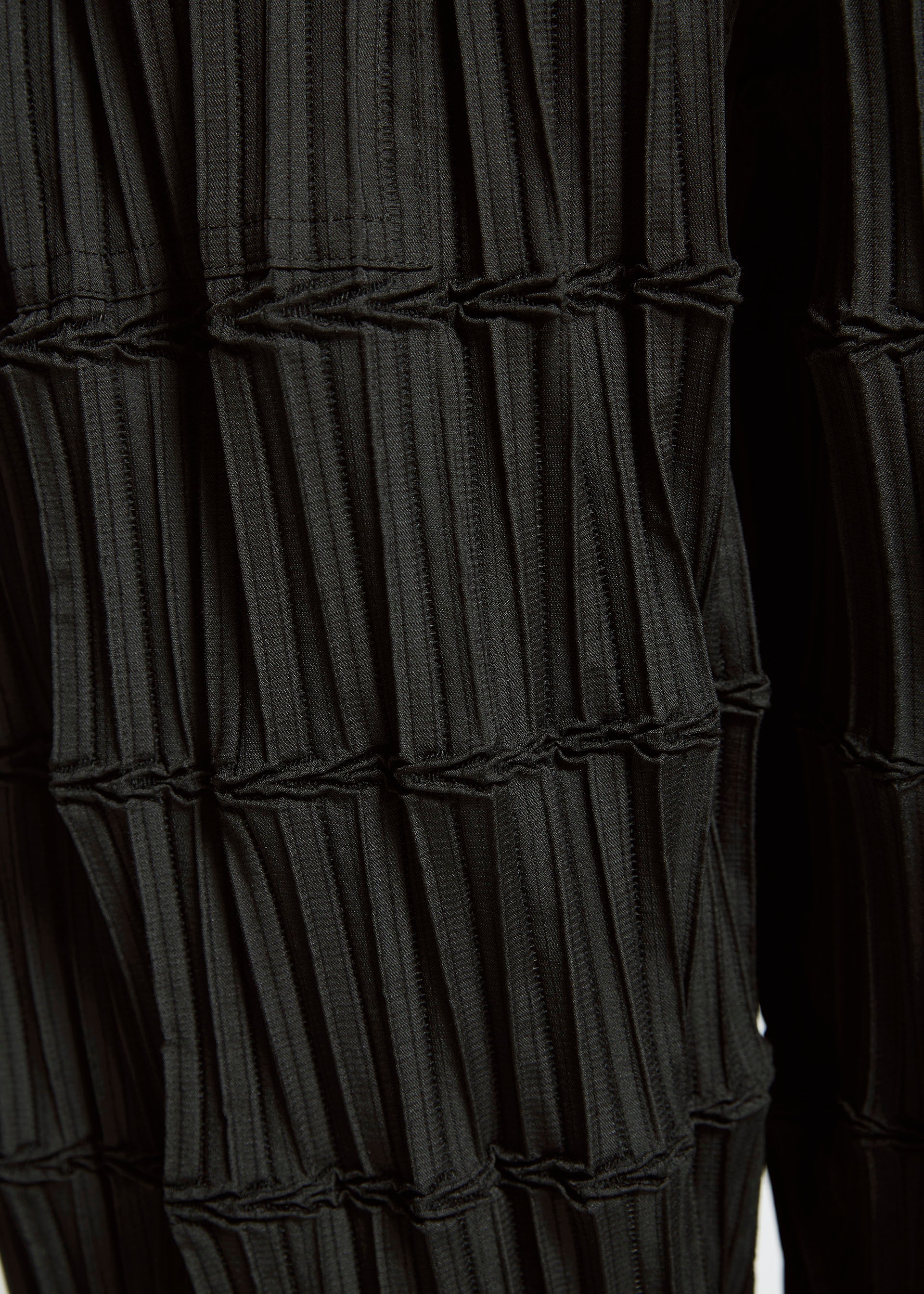 A model wears the A-Poc Able Issey Miyake TYPE O 015 trousers.