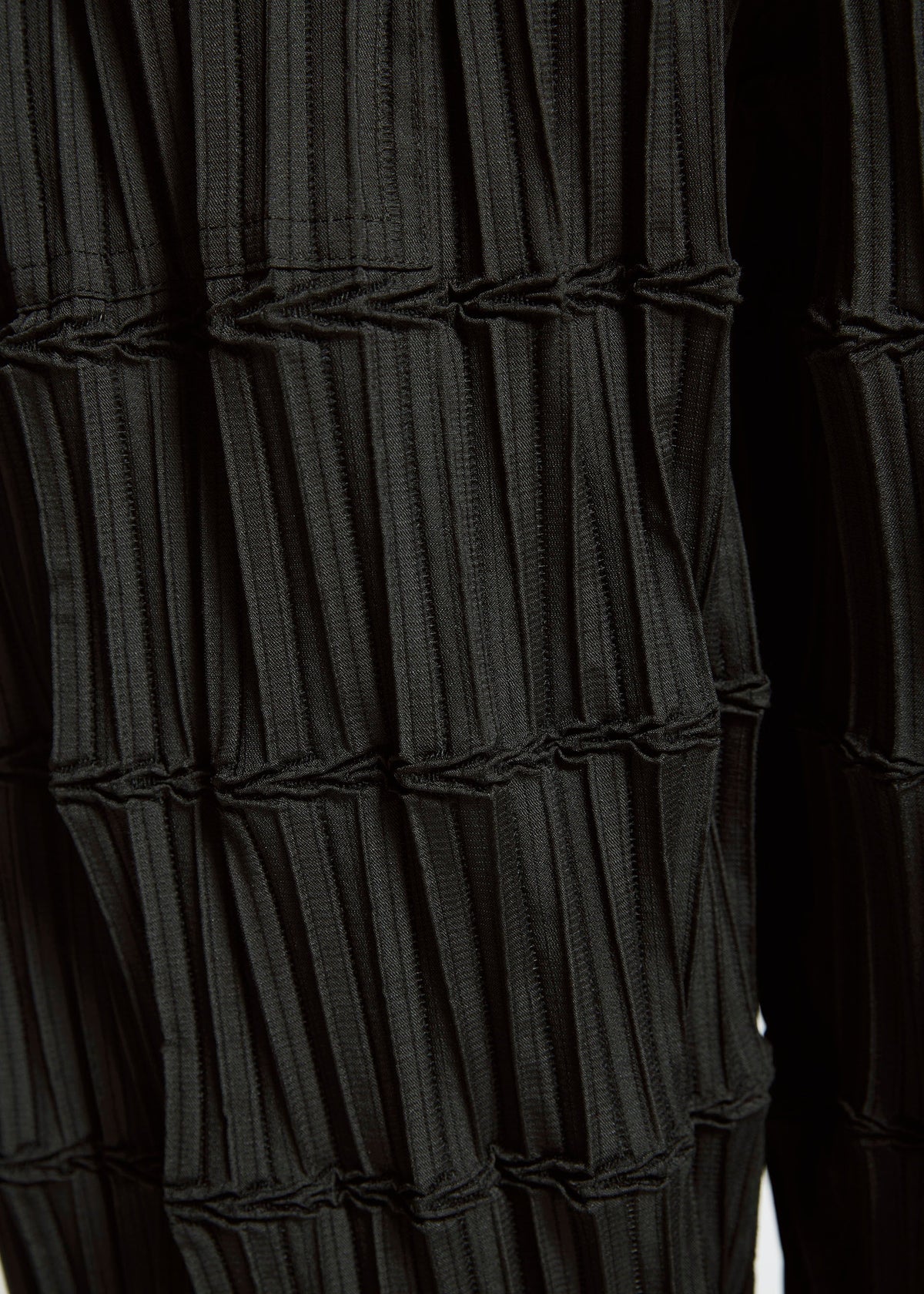 A model wears the A-Poc Able Issey Miyake TYPE O 015 trousers.