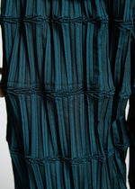 A model wears the A-Poc Able Issey Miyake TYPE O 015 trousers.