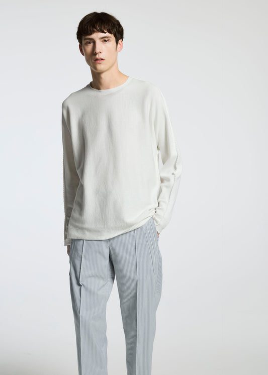 A model wears the A-Poc Able Issey Miyake TYPE S 001 3 trousers.